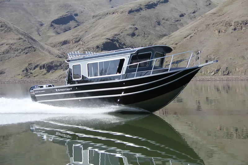 Slide: The Image of 2024 Spartan 2600 Olympia boat on trailer in parking lot, under cloudy sky. - 3