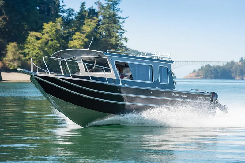 Slide: The Image of 2024 Spartan 2600 Olympia boat with spacious deck and modern design. - 8