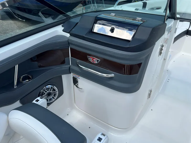 Slide: The Image of 2024 Chaparral 287 SSX boat interior with sleek dashboard and premium finishes. - 4