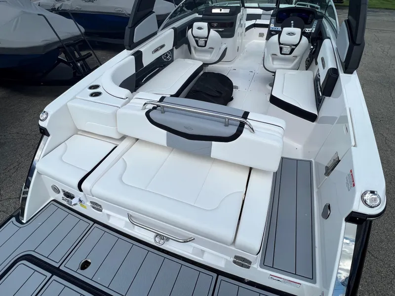 Slide: The Image of 2024 Chaparral 287 SSX boat interior with white seating and modern design. - 6