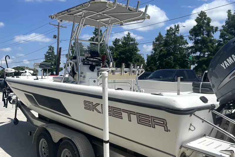 Slide: The Image of 2004 Skeeter ZX 2400 boat on trailer, side view, sunny day. - 6