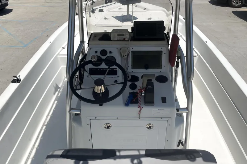 Slide: The Image of 2004 Skeeter ZX 2400 boat console with steering wheel and navigation equipment. - 8