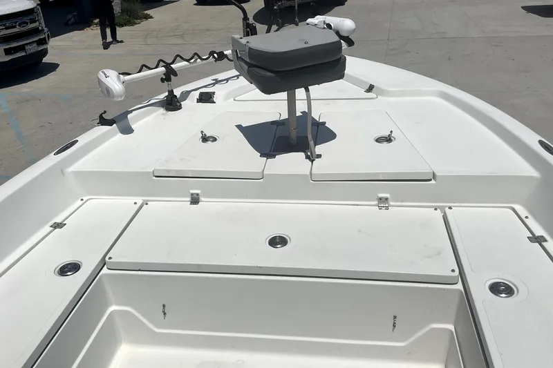 Slide: The Image of 2004 Skeeter ZX 2400 boat deck with storage compartments and seating. - 9