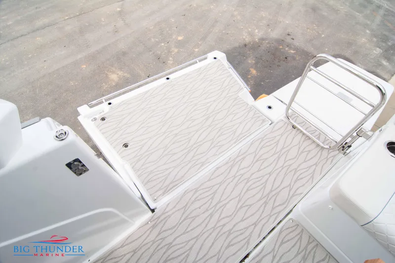 Slide: The Image of 2024 Jeanneau DB/37 OB boat deck with patterned flooring and ladder. - 20