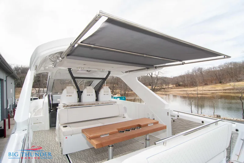 Slide: The Image of 2024 Jeanneau DB/37 OB boat with spacious deck and retractable sunshade. - 24