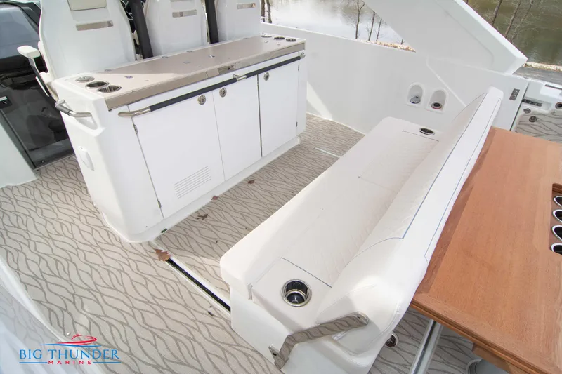 Slide: The Image of 2024 Jeanneau DB/37 OB boat interior with seating and storage. - 26