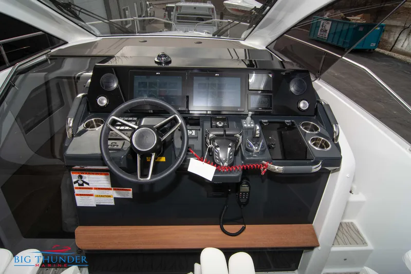 Slide: The Image of 2024 Jeanneau DB/37 OB boat helm with modern controls and navigation screens. - 36