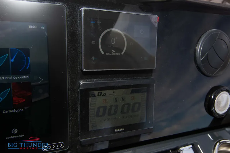 Slide: The Image of Control panel of the 2024 Jeanneau DB/37 OB boat with digital displays. - 42