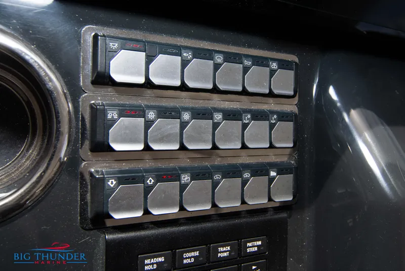 Slide: The Image of Control panel of 2024 Jeanneau DB/37 OB boat with labeled switches. - 45