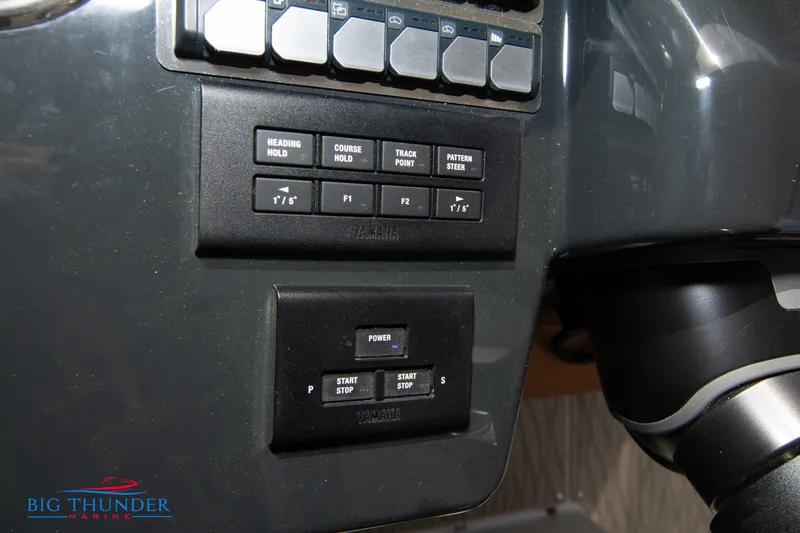 Slide: The Image of Control panel of 2024 Jeanneau DB/37 OB boat with various buttons and switches. - 46