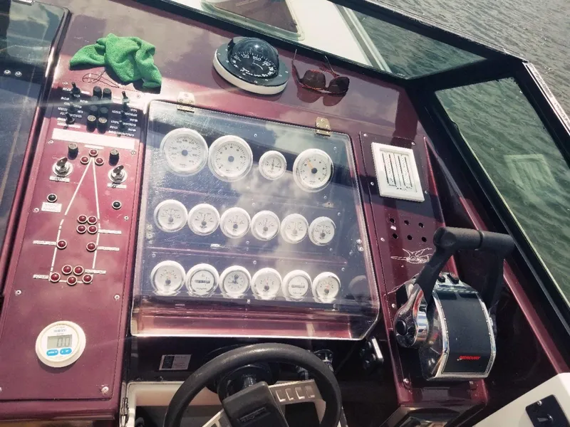 Slide: The Image of 1985 Wellcraft Excalibur Eagle 42 boat dashboard with gauges and controls. - 3