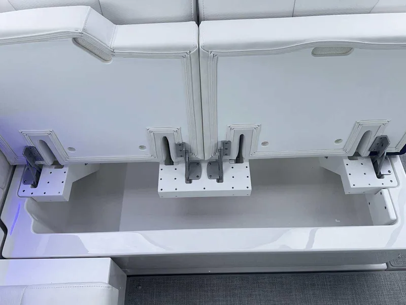 Slide: The Image of 2025 Formula 380 Super Sport Crossover OB boat seating with storage compartment. - 19