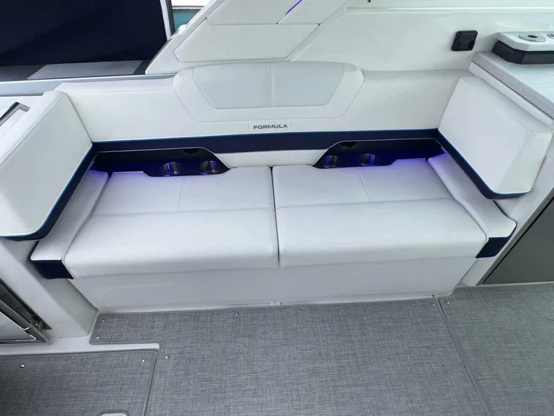 Slide: The Image of 2025 Formula 380 Super Sport Crossover OB interior seating with modern design and ambient lighting. - 22