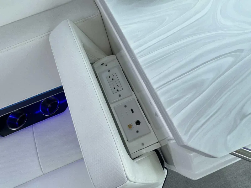 Slide: The Image of 2025 Formula 380 Super Sport Crossover OB interior with power outlets and sleek seating. - 23