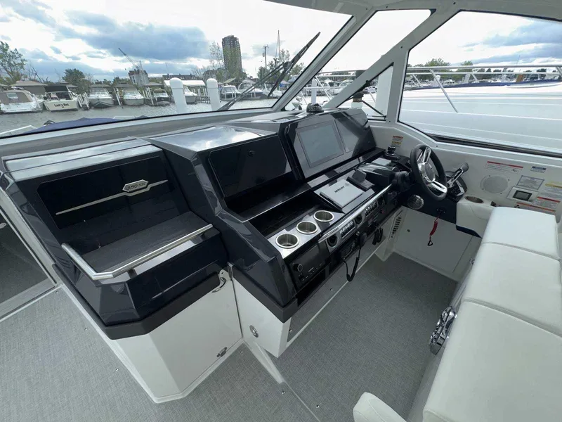 Slide: The Image of 2025 Formula 380 Super Sport Crossover OB cockpit with modern controls and seating. - 33