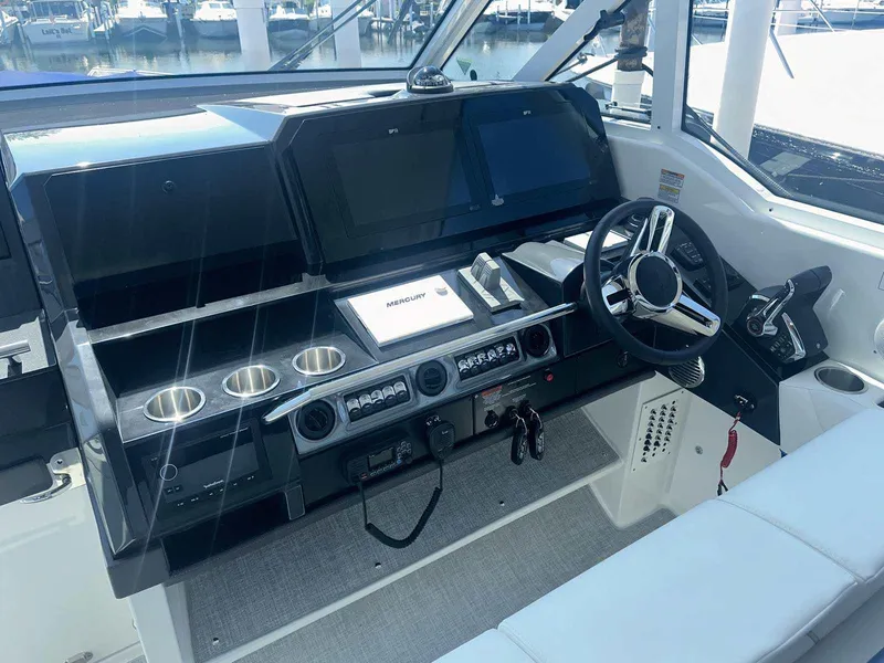 Slide: The Image of 2025 Formula 380 Super Sport Crossover OB helm with modern controls and sleek design. - 37
