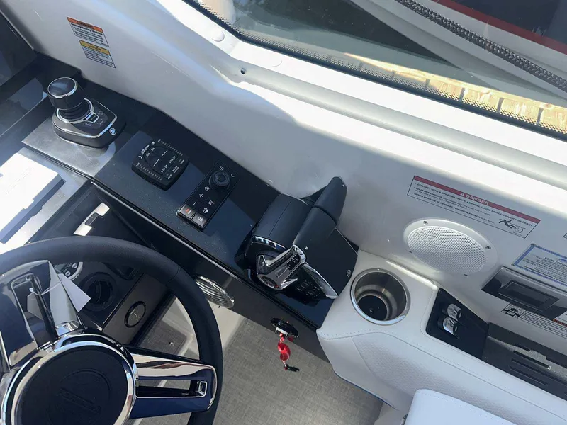 Slide: The Image of 2025 Formula 380 Super Sport Crossover OB helm with controls and steering wheel. - 41