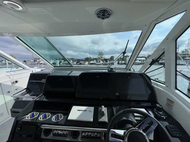 Slide: The Image of Interior view of 2025 Formula 380 Super Sport Crossover OB boat cockpit. - 43