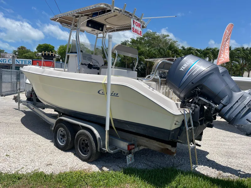 Slide: The Image of 2006 Cobia 254 Center Console boat for sale with Yamaha outboard motor. - 1