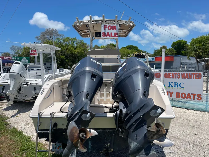 Slide: The Image of 2006 Cobia 254 Center Console boat for sale with twin outboard engines. - 2