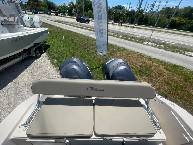 Slide: The Image of 2006 Cobia 254 Center Console boat with twin outboard engines. - 4