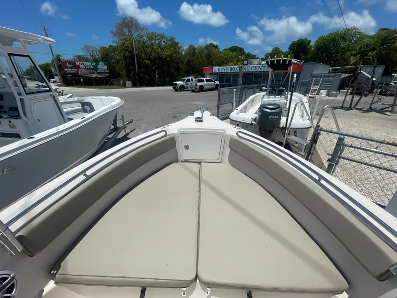 Slide: The Image of 2006 Cobia 254 Center Console boat with cushioned bow seating. - 7