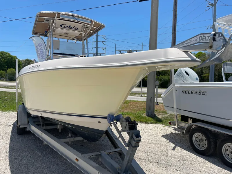 Slide: The Image of 2006 Cobia 254 Center Console boat on a trailer. - 9