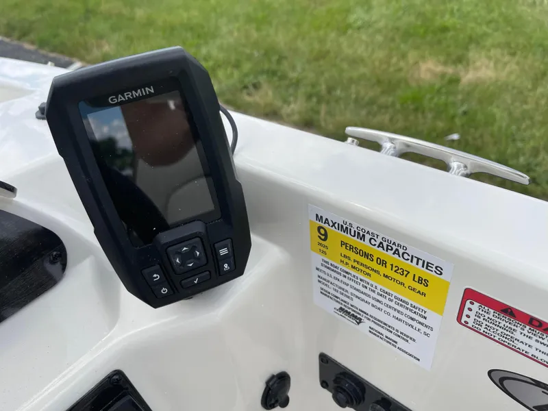 Slide: The Image of Garmin device on 2024 Stingray 182 SC boat with capacity label. - 10