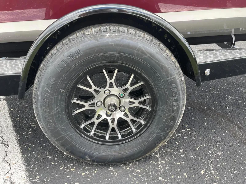 Slide: The Image of Close-up of a 2024 Stingray 182 SC trailer wheel and tire. - 7