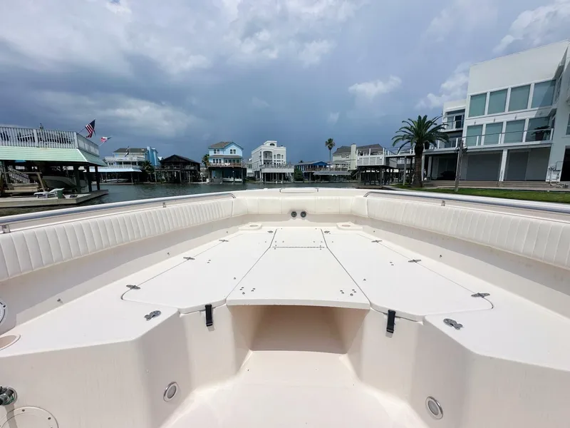 Slide: The Image of Grady-White 366 Canyon boat with 2020 Suzuki engines, docked in a residential canal. - 12