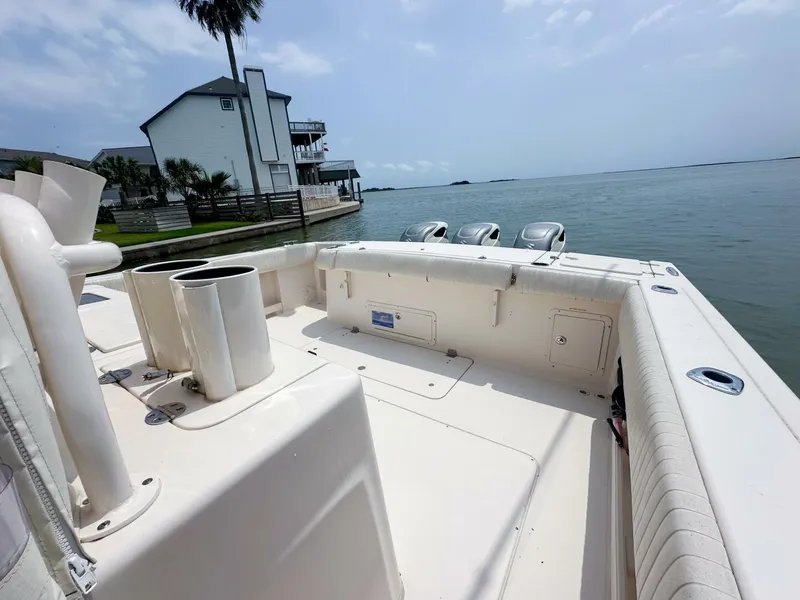Slide: The Image of Grady-White 366 Canyon boat with 2020 Suzuki engines docked by waterfront home. - 15