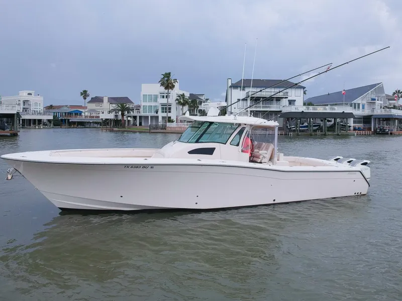 Slide: The Image of 2011 Grady-White 366 Canyon boat with 2020 Suzuki engines on the water. - 27