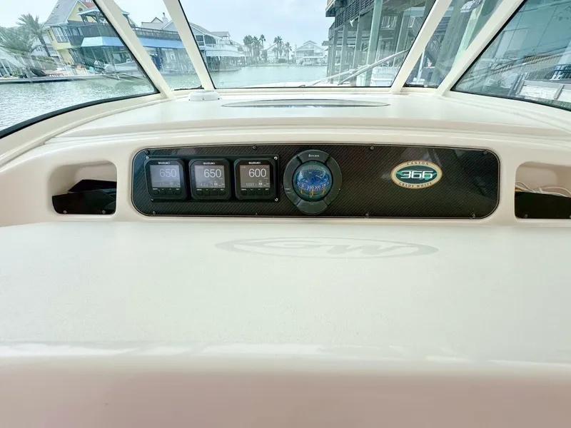Slide: The Image of Grady-White 366 Canyon 2011 dashboard with 2020 Suzuki engines, docked in a marina. - 4
