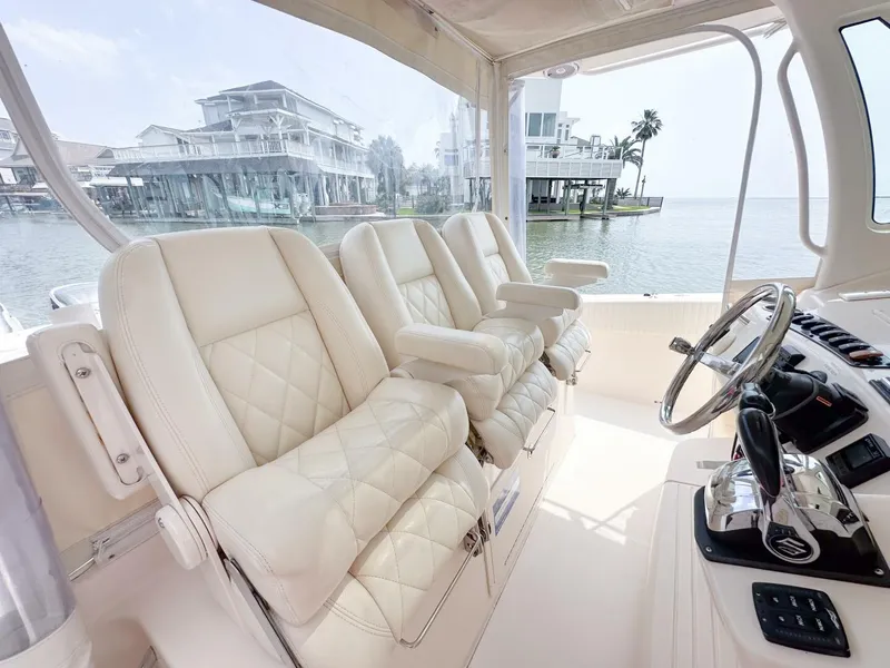 Slide: The Image of Luxurious interior of 2011 Grady-White 366 Canyon boat with 2020 Suzuki engines. - 6