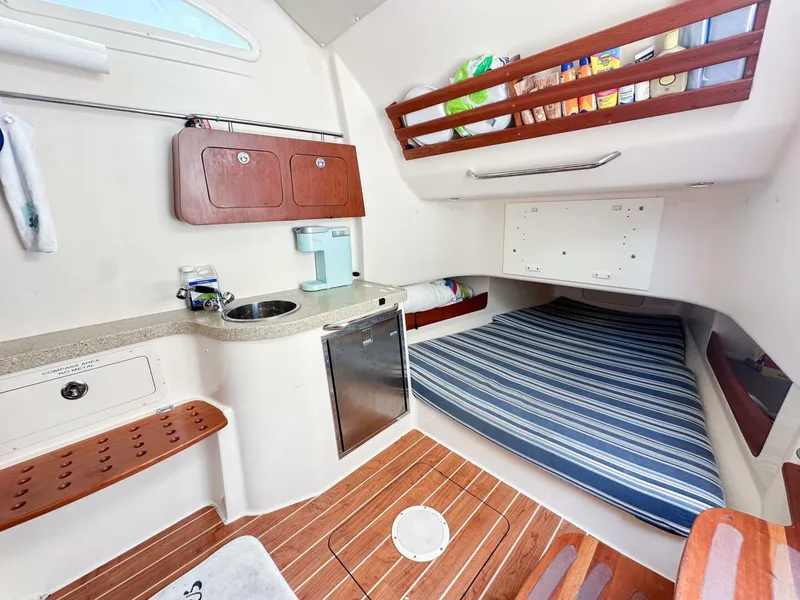 Slide: The Image of Interior cabin of 2011 Grady-White 366 Canyon with 2020 Suzuki engines. - 7