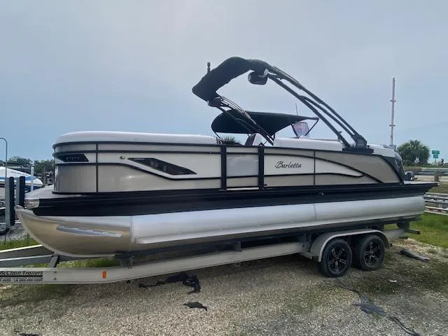 The Image of 2024 Barletta CORSA 23 QSSA pontoon boat on a trailer. - 0