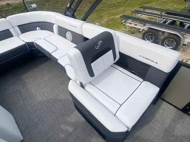 Slide: The Image of 2024 Barletta CORSA 23 QSSA boat interior with white and black seating. - 14