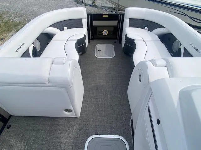 Slide: The Image of 2024 Barletta CORSA 23 QSSA boat interior with white seating and gray flooring. - 19