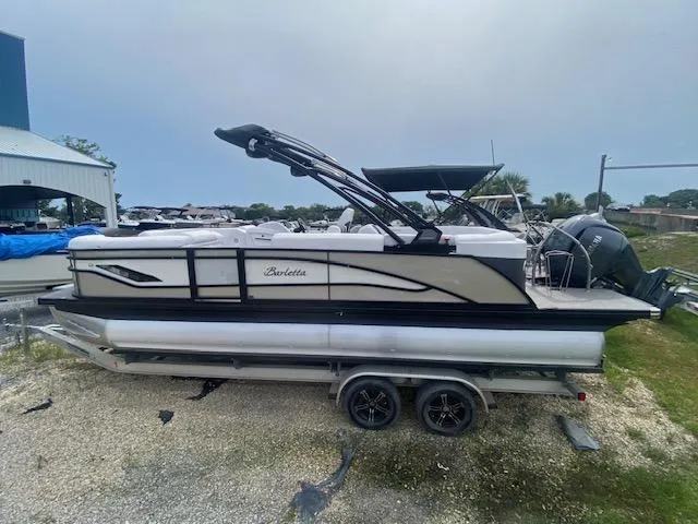 Slide: The Image of 2024 Barletta CORSA 23 QSSA pontoon boat on trailer, side view. - 3