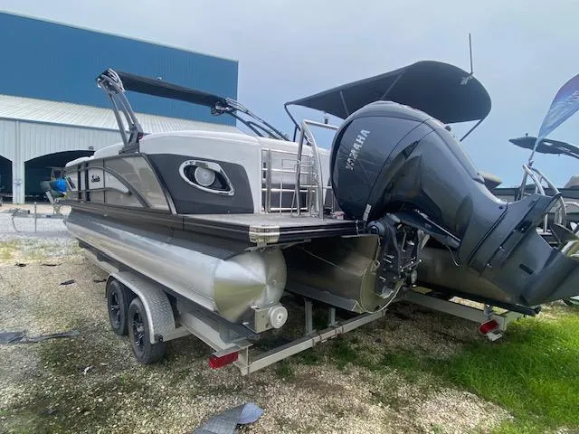 Slide: The Image of 2024 Barletta CORSA 23 QSSA pontoon boat with Yamaha outboard motor. - 5