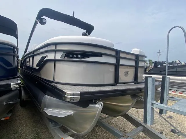Slide: The Image of 2024 Barletta CORSA 23 QSSA pontoon boat on a trailer, rear view. - 9