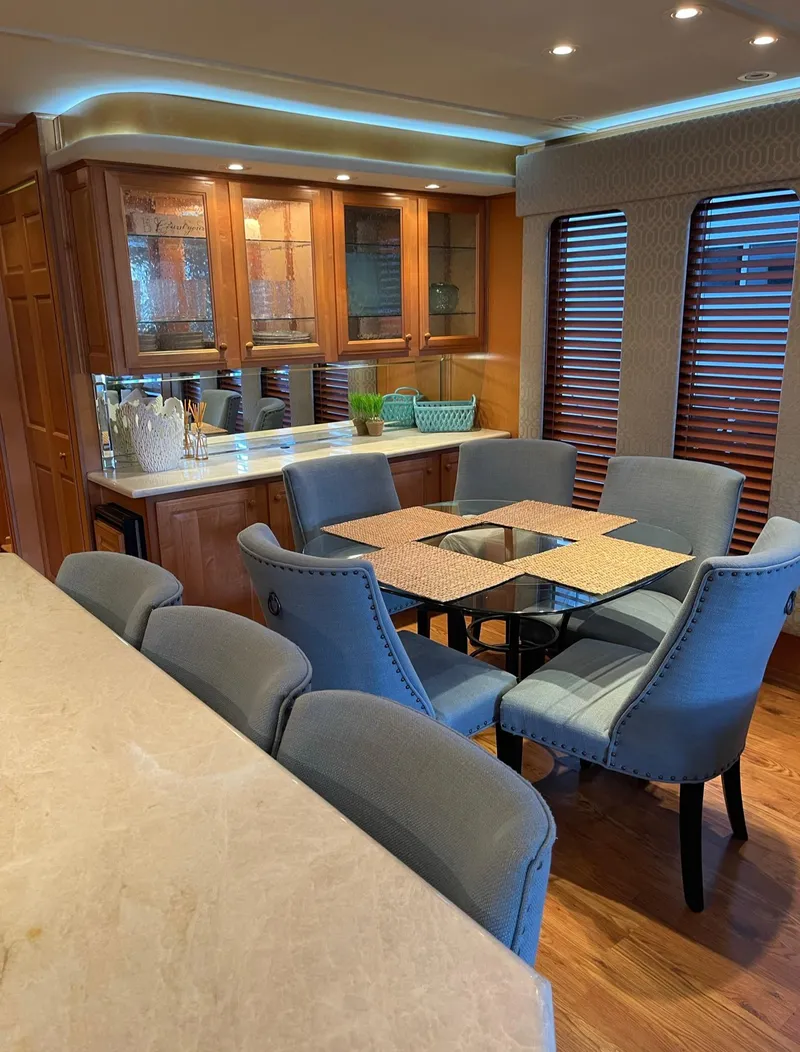 Slide: The Image of Luxurious dining area in a 2003 Sharpe 75' Houseboat with modern furnishings. - 10