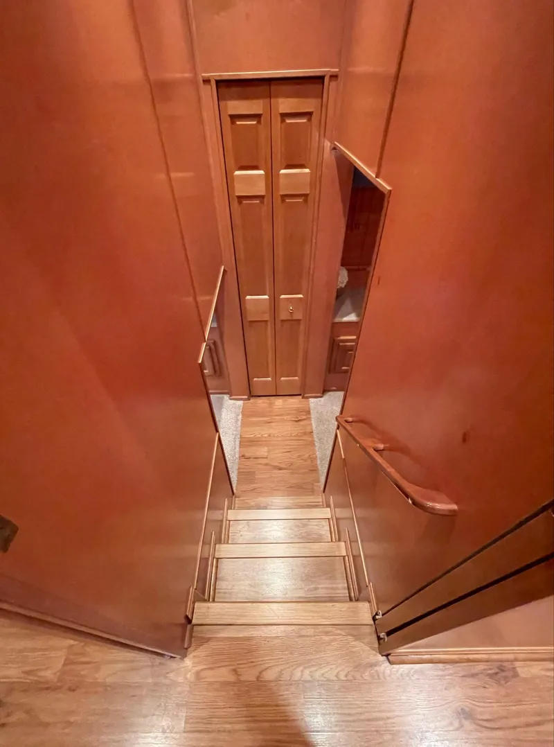 Slide: The Image of Staircase in 2003 Sharpe 75' Houseboat with wooden interior. - 16