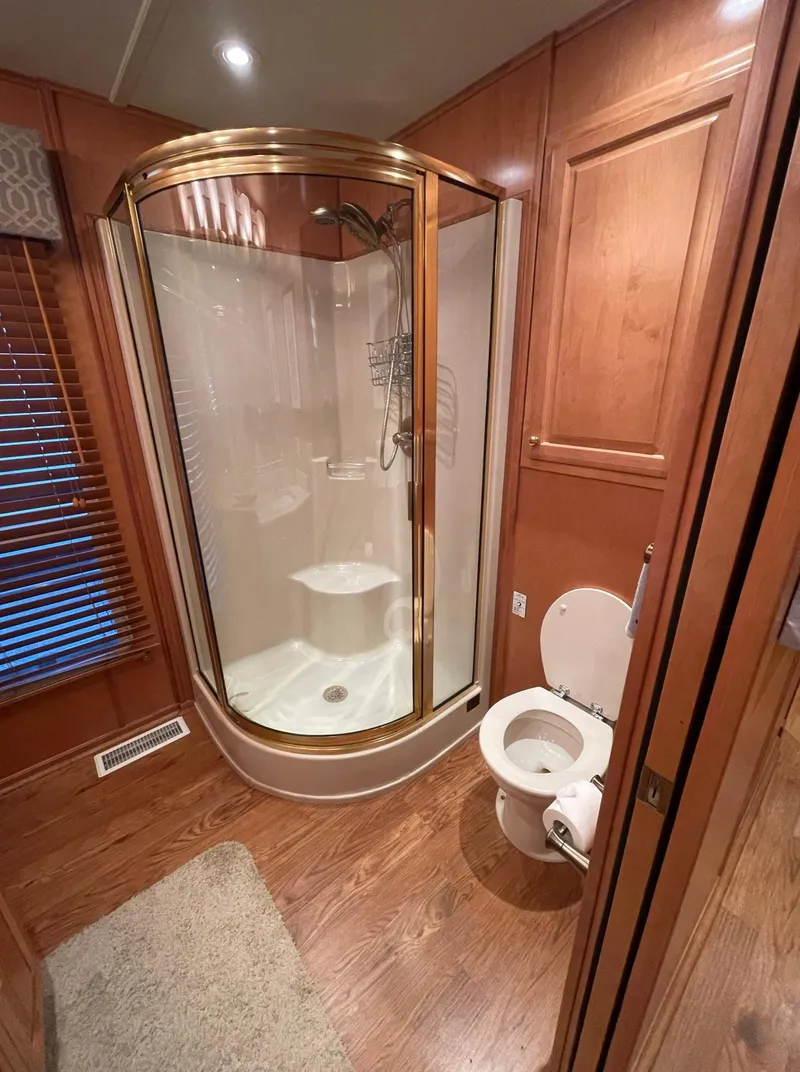 Slide: The Image of 2003 Sharpe 75' Houseboat bathroom with shower and toilet - 21