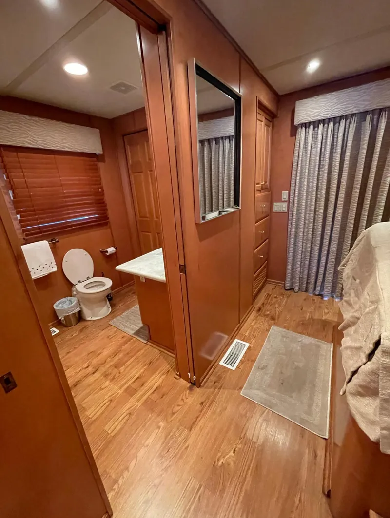 Slide: The Image of Interior of 2003 Sharpe 75' Houseboat with bathroom and bedroom view. - 28