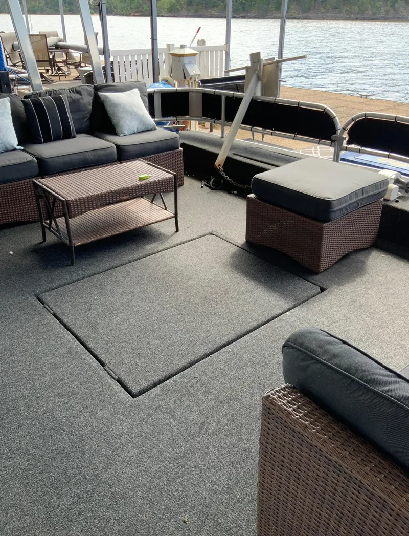Slide: The Image of Outdoor seating area on a 2003 Sharpe 75' Houseboat with wicker furniture and lake view. - 34
