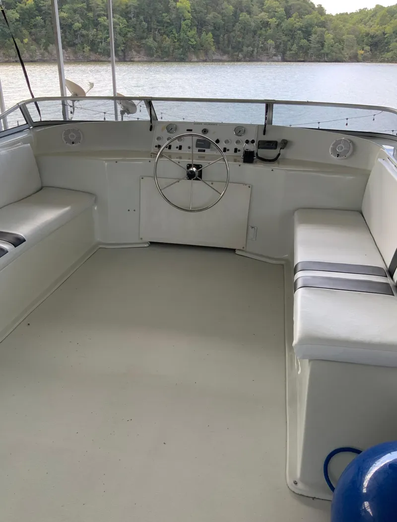 Slide: The Image of 2003 Sharpe 75' Houseboat helm with lake view and seating. - 36