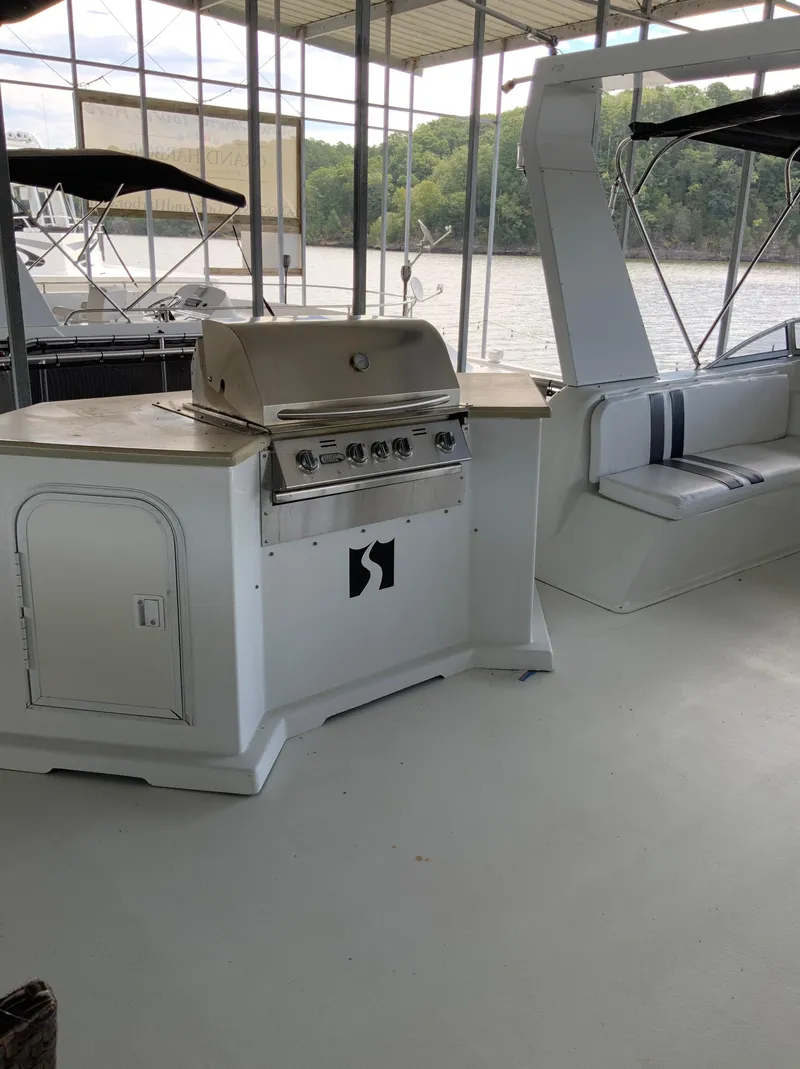 Slide: The Image of 2003 Sharpe 75' Houseboat with outdoor grill and seating area. - 37