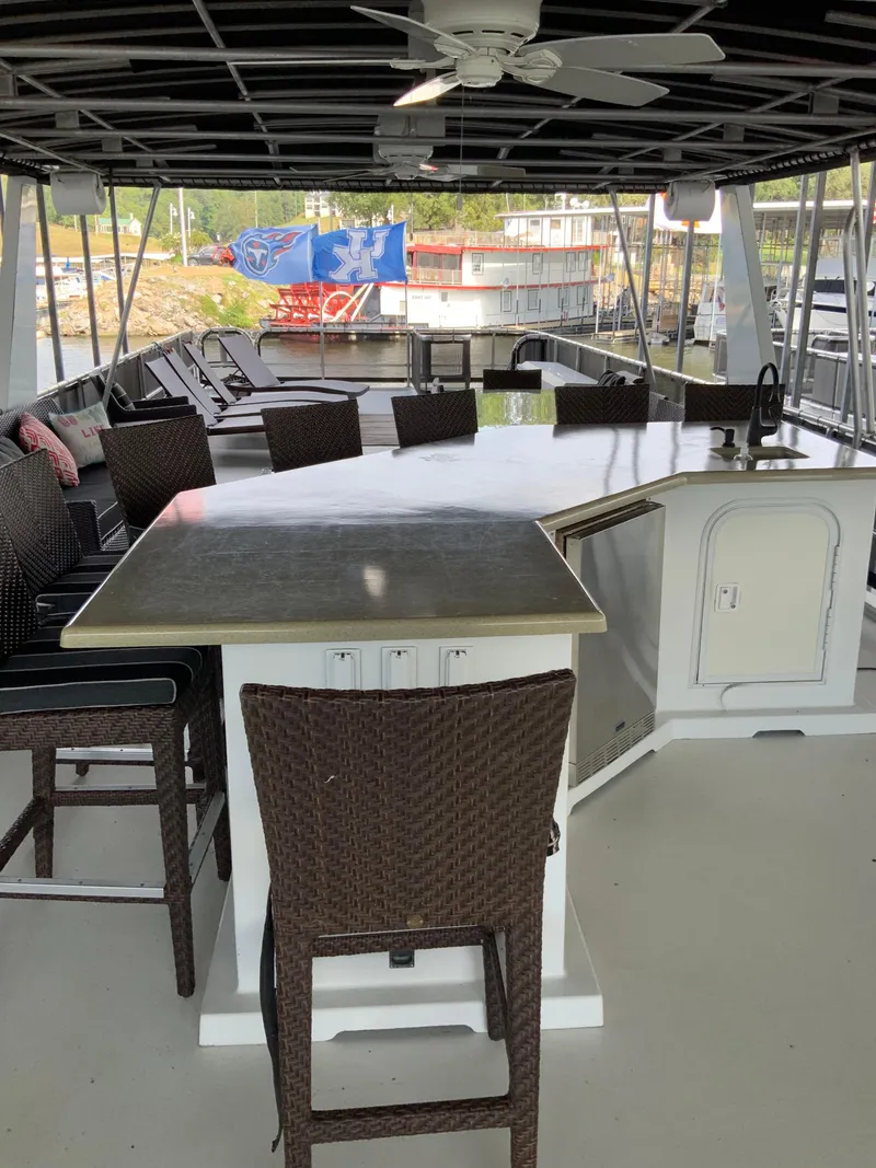 Slide: The Image of 2003 Sharpe 75' Houseboat upper deck with bar and seating area. - 40