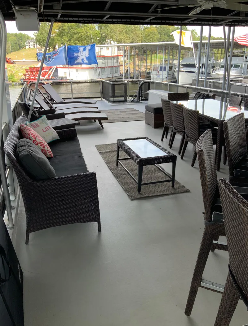 Slide: The Image of Spacious deck of a 2003 Sharpe 75' Houseboat with outdoor seating and dining area. - 41